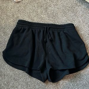 Casual, comfy, stretchy black fleece shorts with pockets